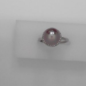 10mm Cultured pink pearl with sterling silver and cubic zirconia - Size adjustable NewMade by 10mm cultured freshwater pink pearl, sterling silver,and cubic zirconia. The pink color is natural color. The size can be adjusted from size 5 to size 9.