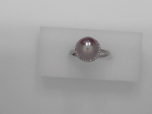 10mm Cultured pink pearl with sterling silver and cubic zirconia - Size adjustable NewMade by 10mm cultured freshwater pink pearl, sterling silver,and cubic zirconia. The pink color is natural color. The size can be adjusted from size 5 to size 9.