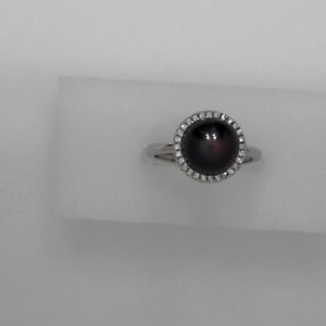 10mm Cultured peacock pearl with sterling silver and cubic zirconia - Size adjustableMade by 10mm cultured freshwater peacock pearl, sterling silver,and cubic zirconia. The size can be adjusted from size 5 to size 9.