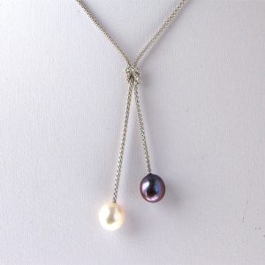 11mm cultured white and peacock pearls pendant11mm 18 inch cultured freshwater white and peacock pearl pendant and sterling silver chain. The pearls are the best luster and flawless.