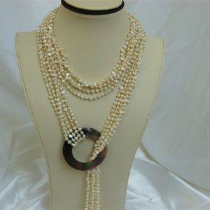 Miracle necklace (White) This amazing miracle necklace is made by 4-6mm cultured freshwater pearl in 45 inch. The ring made by mother of pearl. The color is white. The necklace is open ended, and can be worn by many creative ways, such as belt, twis