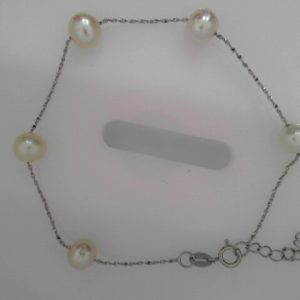 Station bracelet - 7.5inch 7mm cultured white pearl7mm cultured white freshwater pearls station bracelet in 7.5 inches. The pearls are lustrous. The chain is rhodium over copper. Matching with station necklace S001