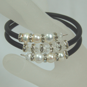 7-8mm Cultured white pearls and crystal double snake silicone braceletThis dressy bracelet made by 7-8mm freshwater cultured white pearls, crystals, and crystal bars and black silicone. The length is flexible and fits everyone.