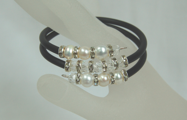 7-8mm Cultured white pearls and crystal double snake silicone bracelet

This dressy bracelet made by 7-8mm freshwater cultured white pearls, crystals, and crystal bars and black silicone. The length is flexible and fits everyone.