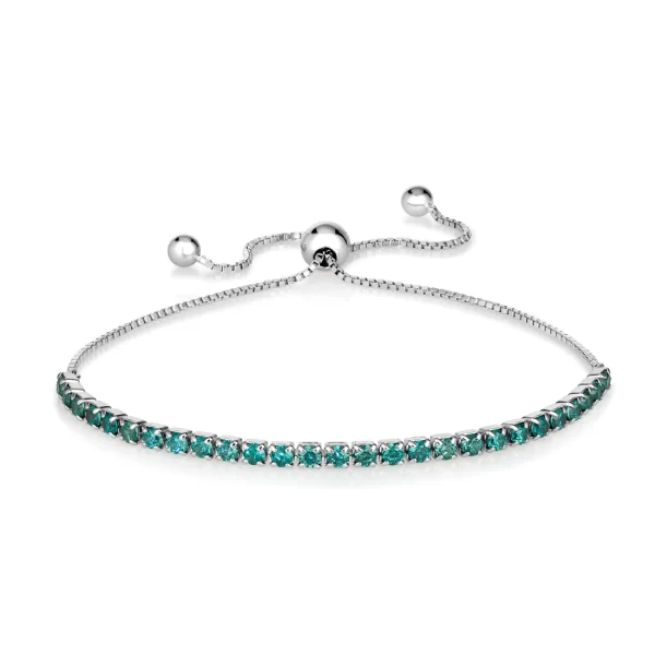 Elevate your wrist game with our exquisite adjustable bolo bracelet. Adorned with 2 mm diamond crystalline, this versatile piece offers a perfect fit for most sizes, adding a touch of glamour to any ensemble.Stone Type: Paraiba TourmalineGem Origin: