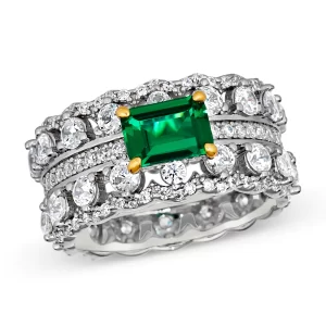 DescriptionCapture eternal love with our exquisite Amore ring. This stunning piece features a continuous 8 mm band of sparkling gemstones and diamond crystalline, symbolizing everlasting romance and timeless elegance.Main Stone: Green EmeraldMain St